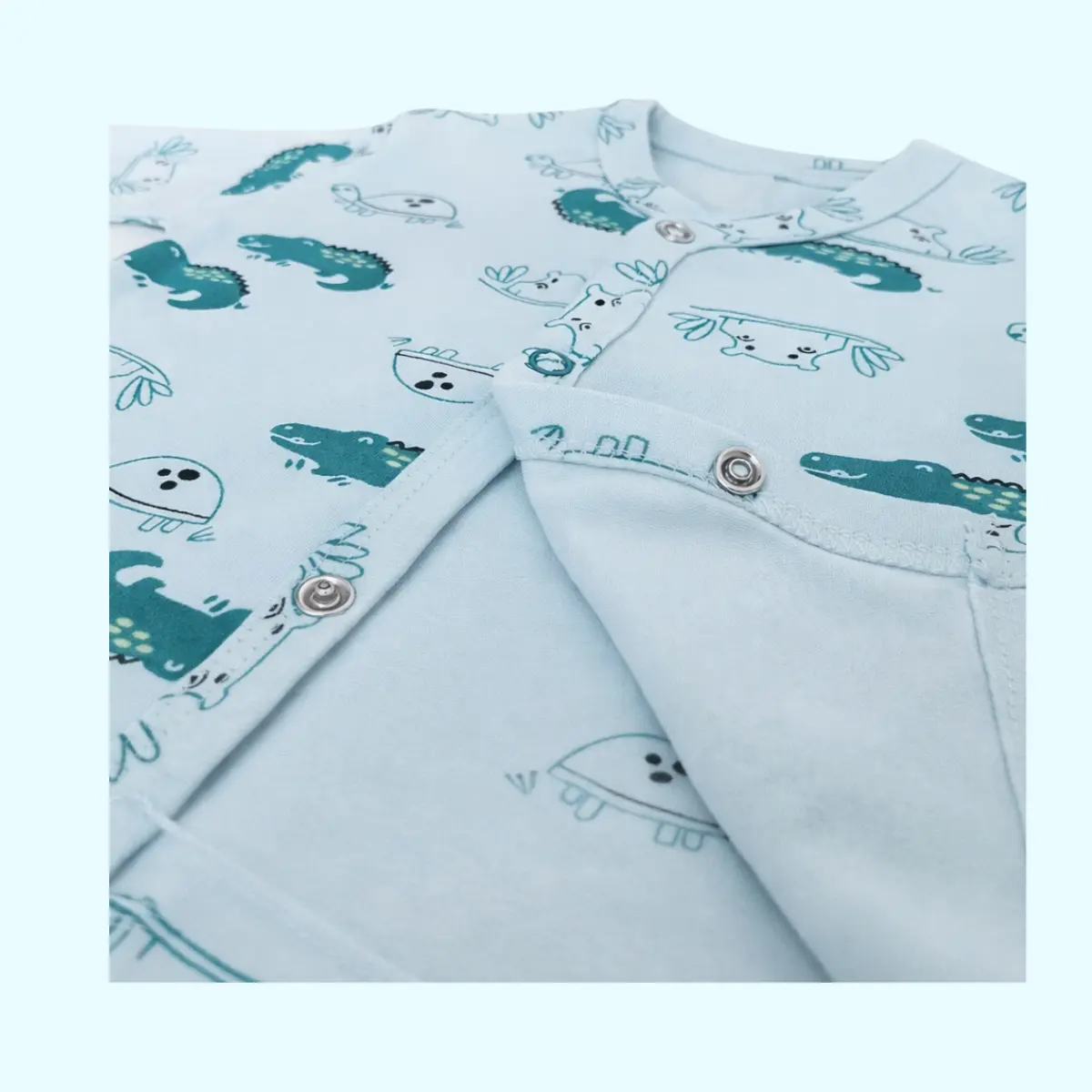 crocodile print baby clothing cotton fabric close up snap button detail