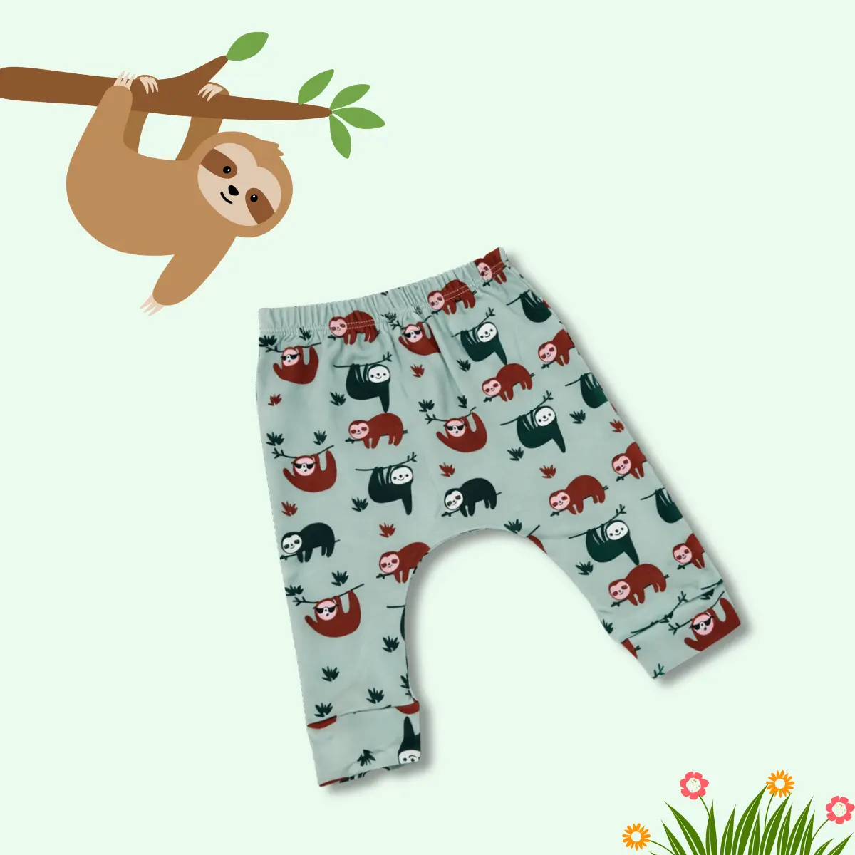 Baby cotton pants with cute sloth print in soft sage green, designed with a relaxed fit and diaper-friendly space for comfort