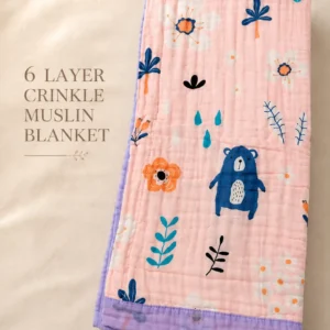 Folded Bamboree 6 layer crinkle muslin baby blanket featuring a beautiful Baby Blooms floral print in soft pastel shades.